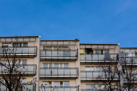 Photo for Facade with balconies in an apartment block. Multi-family housing, the object against the blue sky. - Royalty Free Image