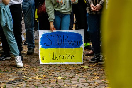 Photo for Children holding a sign Stop war in Ukraine at a protest against war in Ukraine in Baden Baden, Germany - Royalty Free Image