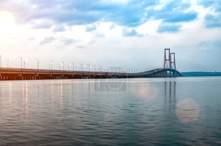Photo for Suramadu Bridge at sunset and the street lights are starting to come on - Royalty Free Image