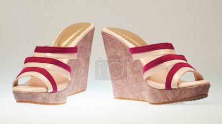 Photo for Women's wedge sandals with high heels and cream colored wood motifs - Royalty Free Image