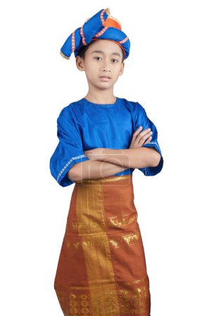 a 10 years old boy wearing traditional clothes from Aceh, Indonesia. Isolated on White background