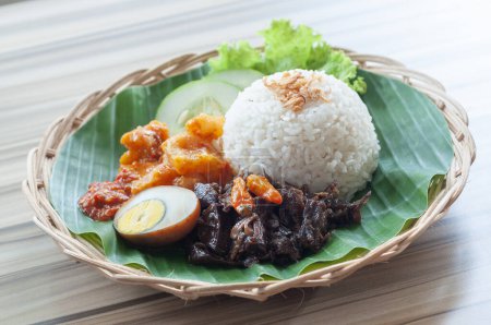 Nasi Kikil Daging Suwir or Shredded beef with Rice served with spicy vegetables