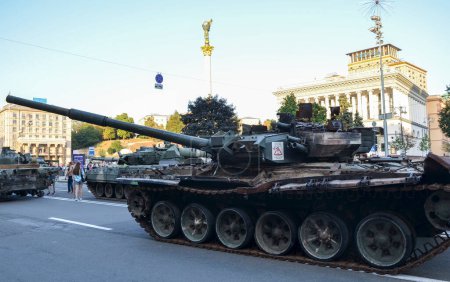 Photo for Broken down and rusting russian tanks in in Khreshchatyk, the main street of Kyiv during exhibition before Independence Day of Ukraine - Royalty Free Image