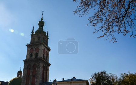 Photo for Korniakt Tower of the Church of the Assumption of the Blessed Virgin Mary and blue sky on background, Lviv architecture, Ukraine - Royalty Free Image