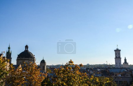 Photo for Autumn skyline with cupola of Dominican cathedral, Town Hall tower and other Cathedrals are popular tourist attractions in Lviv, Ukraine - Royalty Free Image
