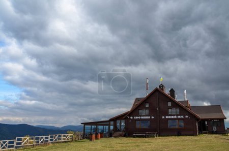 Photo for Exterior of wooden Carpathian national cafe (Kolyba) "Vysoky Verkh" at high of the mountains, Ukraine - Royalty Free Image