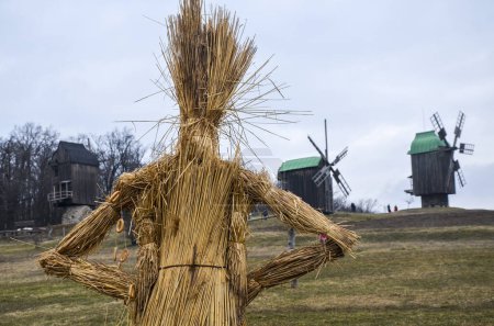 Photo for Straw effigy before burning on traditional holiday Shrovetide dedicated to the approach of spring - Royalty Free Image