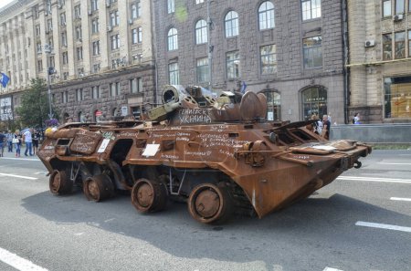 Photo for Destroyed as a result of an artillery strike BTR-80 armored personnel carrier of russian invaders display on Khreschatyk Street in the center of Kyiv - Royalty Free Image