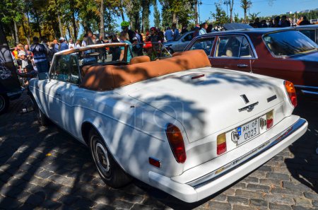 Photo for Back view of luxurious white collectible rare convertible Rolls-Royce Corniche of which only about 5 thousand copies were produced - Royalty Free Image