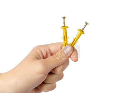 Photo for Plastic Wall Screw Anchor Plugs in hand. High quality photo - Royalty Free Image