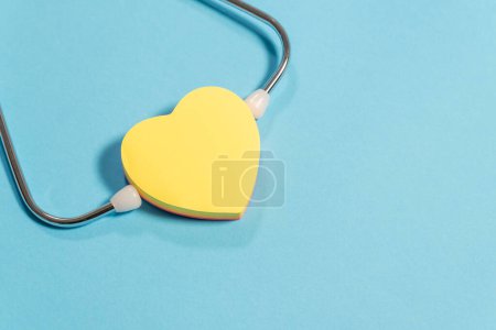 Photo for Single Head Stethoscope with heart on light blue background - Royalty Free Image