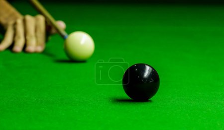 Photo for Man playing snooker balls on green snooker table - Royalty Free Image