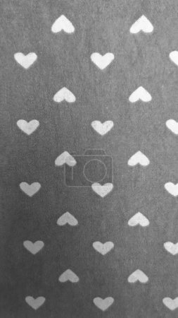 Photo for Black and white vertical mini heart wallpaper, geometric seamless pattern background, with scattered shapes in love concept. - Royalty Free Image