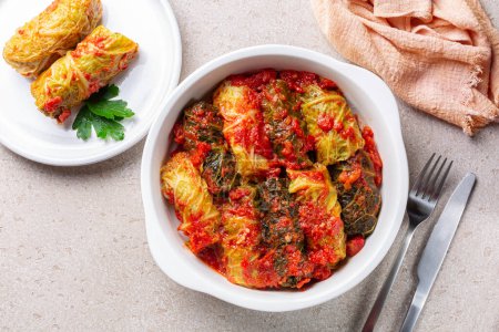 Top view of stuffed savoy cabbage with meat and rice in a tomato sauce.