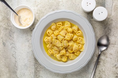 Tortellini in beef and chicken broth. Egg pasta originally from the Italian region of Emilia, Bologna. Stuffed with a mix of meat, prosciutto, mortadella, hard cheese, egg and served in capon broth.