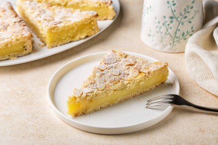 Photo for A piece of Custard cream cake with almonds. Traditional italian pastry, dessert - torta della nonna or grandmother's cake. - Royalty Free Image