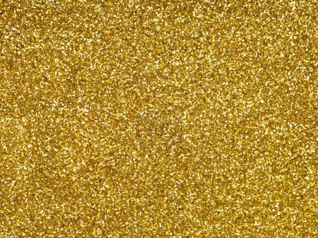 Photo for Golden sparkling shiny glitter. Abstract shiny background. Design pattern texture for decoration and design of Christmas, New Year, other holiday pictures, xmas gift card. Beautiful packaging material - Royalty Free Image