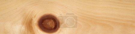 Cette image capture élégamment une surface en bois de placages de pin, en mettant l'accent sur le n?ud naturel frappant qui sert de pièce maîtresse étonnante, accentuant l'attrait organique des bois