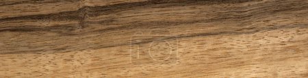 The image reveals the distinctive character of black limba veneer, featuring striking contrasts in its rich wood patterns, ideal for bold and sophisticated design projects