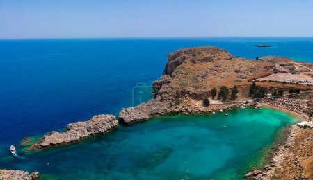 Photo for Aerial birds eye view drone photo Saint Paul bay near village Lindos, Rhodes island, Dodecanese, Greece. Sunny panorama with lagoon and clear blue water. Famous tourist destination in South Europe - Royalty Free Image