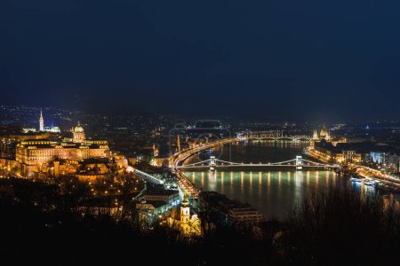 Photo for Night view of Budapest. Cityscape of famous tourist destination with Danube and bridges. Travel illuminated landscape in Hungary, Europe. - Royalty Free Image