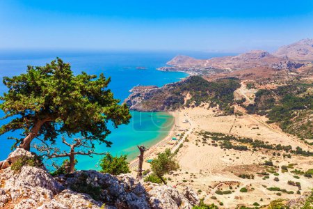 Sea skyview landscape photo Tsambika bay on Rhodes island, Dodecanese, Greece. Panorama with nice sand beach and clear blue water. Famous tourist destination in South Europe