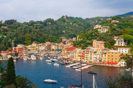 Photo for Sea landscape in Portofino, Liguria, Italy. Scenic fishing village with traditional houses and clear blue water. Summer vacation luxury rich resort with picturesque harbour and celebrity visitors - Royalty Free Image