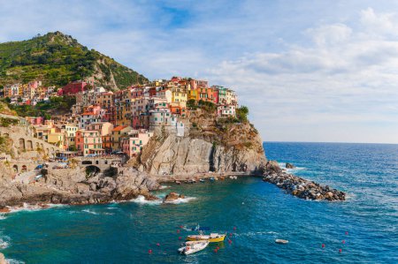 Photo for Sea landscape in Manarola village, Cinque Terre coast of Italy. Scenic beautiful small town in the province of La Spezia, Liguria with traditional houses. Famous tourist destination - Royalty Free Image