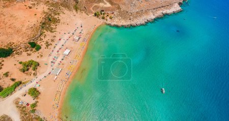 Photo for Aerial birds eye view drone photo Agia Agathi beach near Feraklos castle on Rhodes island, Dodecanese, Greece. Panorama with sand beach and clear blue water. Famous tourist destination in South Europe - Royalty Free Image