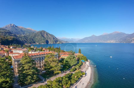 Photo for Aerial view landscape on beatiful Lake Como in Menaggio, Lombardy, Italy. Scenic small town with traditional houses and clear blue water. Summer vacation for tourists on rich resort with nice harbour - Royalty Free Image