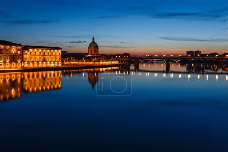 Photo for French ancient town Toulouse and Garonne river panoramic night view. Toulouse is the capital of Haute Garonne department and Occitanie region, France, South Europe. Famous tourist destionation. - Royalty Free Image
