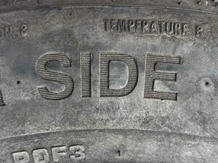 Photo for Closeup of text SIDE on a old tyre with texture and patterns. - Royalty Free Image