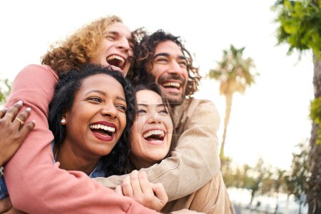 Photo for Embrace People Laughing. Young group of Friends Outdoors. Youth Culture and City Lifestyle. High quality photo - Royalty Free Image