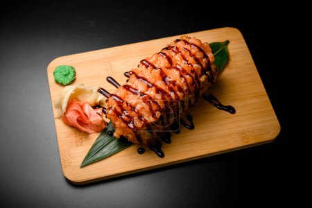 Photo for Delectable breaded dish enhanced with rich teriyaki sauce and generously garnished with succulent salmon pieces for a flavorful treat - Royalty Free Image