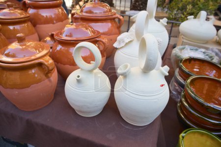 Photo for Detail of some jugs and ceramic and clay jugs in a stall of a traditional open-air marke - Royalty Free Image