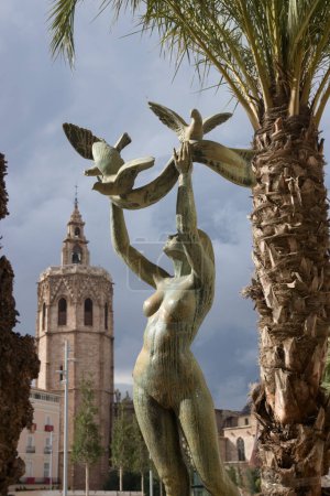 Photo for La Paz y la Concordia: Sculpture to the victims of terrorism that represents a female nude in bronze that raises a veil on which three doves perch - Royalty Free Image
