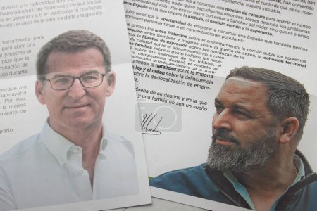 Photo for The electoral propaganda letters of the Popular Party (PP) and VOX parties with the photographs of their leaders, Feijoo and Abascal face to face - Royalty Free Image