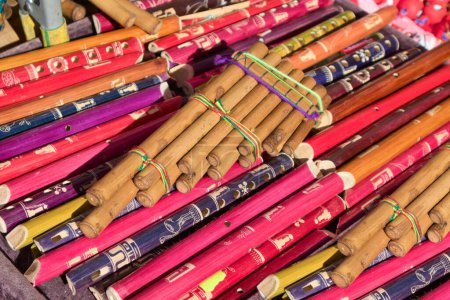 Photo for Closeup of a stall at a street market selling various types of indigenous style bamboo and pan flutes - Royalty Free Image