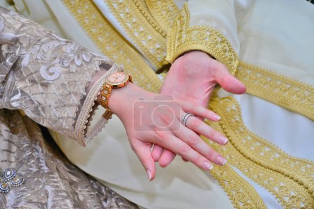 Photo for Close up of moroccon couple's hands at a wedding, concept of marriage, moroccan weddin - Royalty Free Image