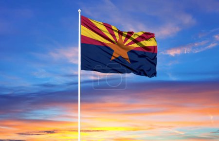 Arizona  flag on flagpoles and blue sk