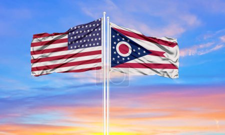 Photo for United States and Ohio two flags on flagpoles and blue sk - Royalty Free Image