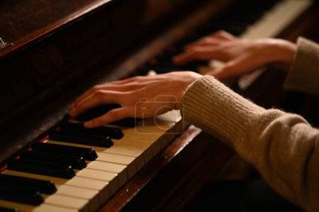 Photo for Female hands playing piano close up view - Royalty Free Image