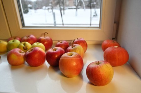 Photo for Ripe fresh apples on windowsill, close up - Royalty Free Image