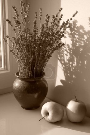 Photo for Apples and lavenders in the vase on windowsill - Royalty Free Image