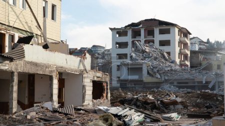 Photo for Earthquake in Turkey. Ruined houses after a massive earthquake in Turkey. Selective focus included - Royalty Free Image