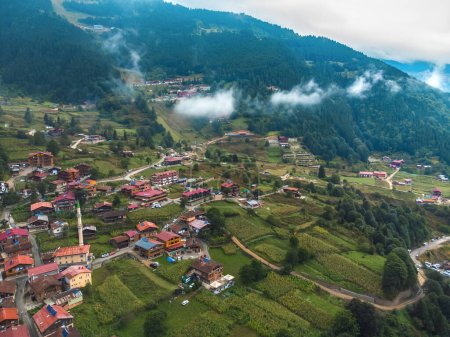 Beautiful view from a drone of a mountain village, hotels in Uzungel on a cloudy day with clouds descending. Famous tourist place Uzungel, Trabzon, Turkey.