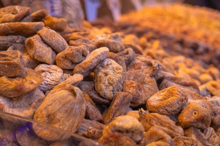 Close-up of dried figs on a counter in the bazaar. Sale of dried fruits.