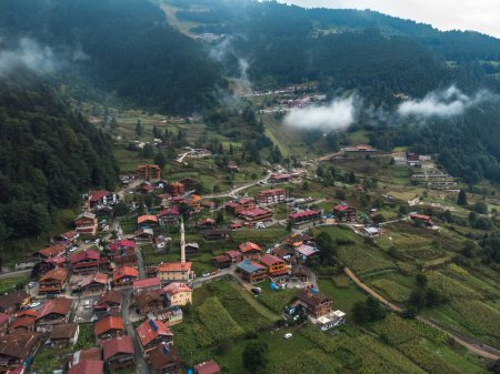 Beautiful view from a drone of a mountain village, hotels in Uzungel on a cloudy day with clouds descending. Famous tourist place Uzungel, Trabzon, Turkey.