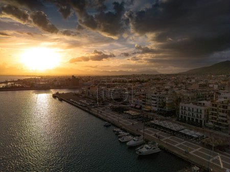 Photo for Aerial iconic sunset view over the port of Kalamata seaside city in Messenia, Greece. - Royalty Free Image