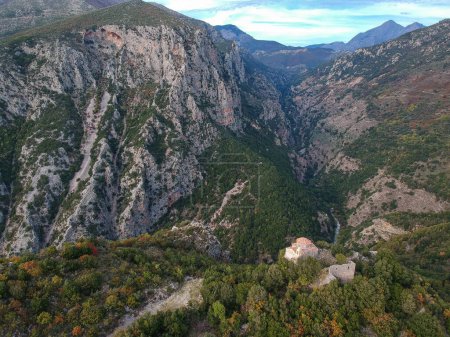 Photo for Amazing view over ridomo gorge in mountainous Mani area. At bottom rignt Prophet Helias traditional christian chapel in Mani, Messenia, Peloponnese in Greece - Royalty Free Image